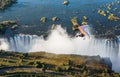 Tourists fly over the Victoria Falls on the trikes. Royalty Free Stock Photo